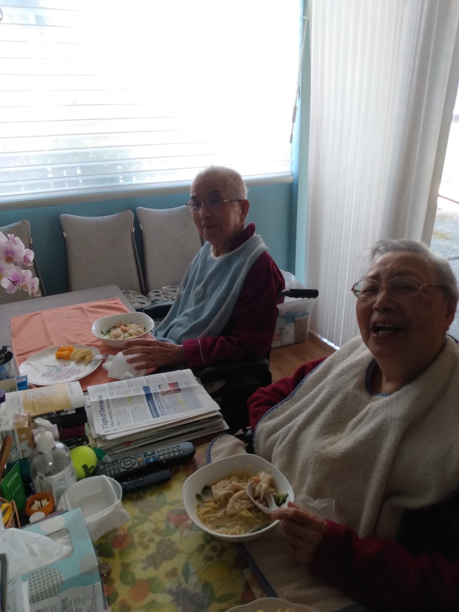 Tim at bedside with family during a client visit