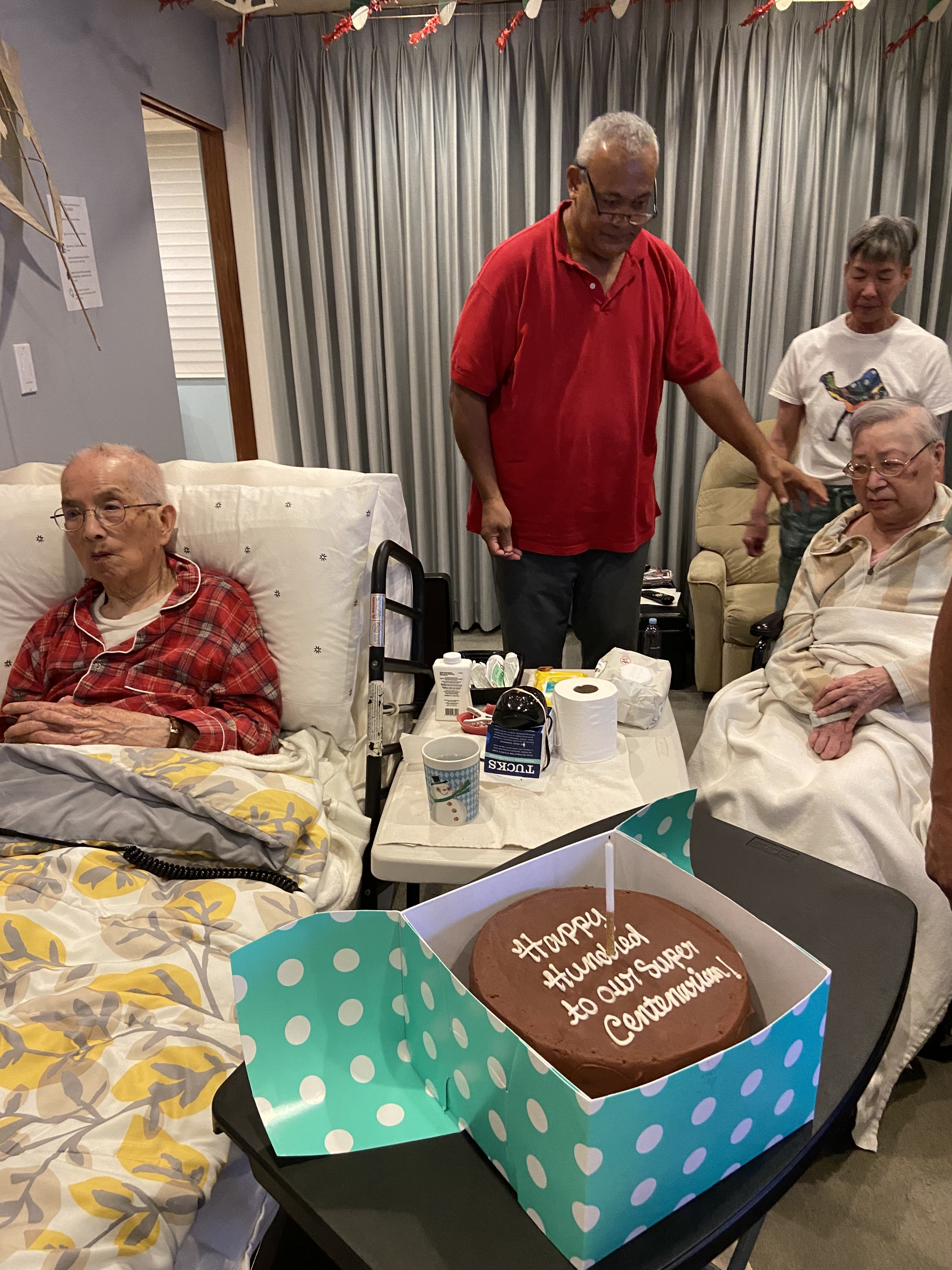Tim celebrating a client's 100th birthday